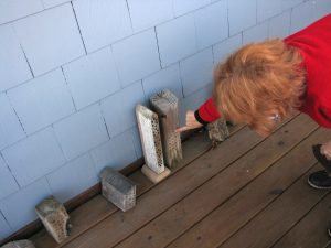 Century home owner Mary Brong explains her bee houses.