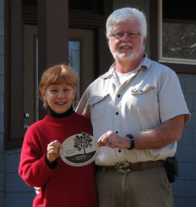Ed Spevak and Mary Brong display their newly minted LPNA century home plaque.